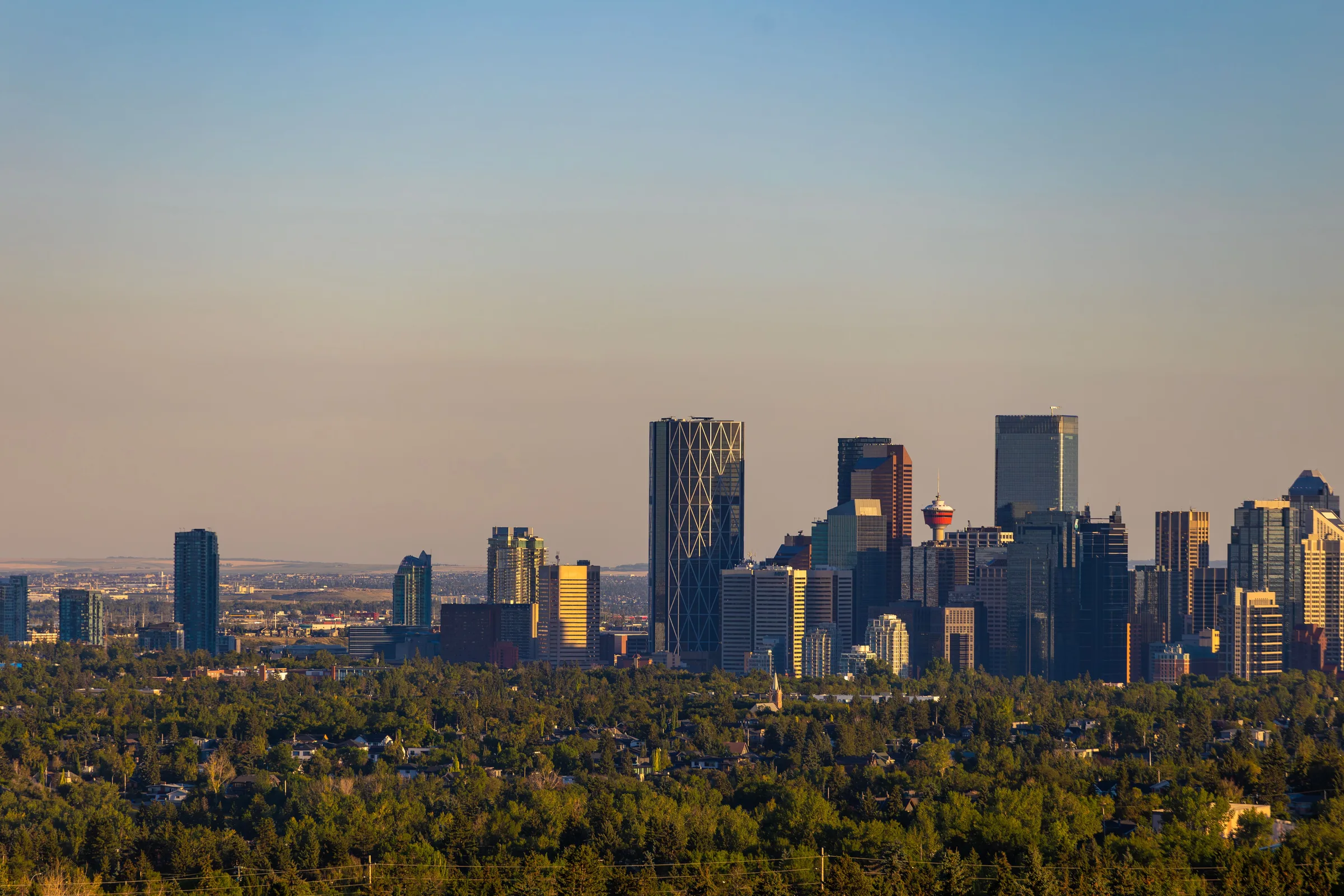 The downtown Calgary skyline at sunrise, the Calgary Tower among the office towers